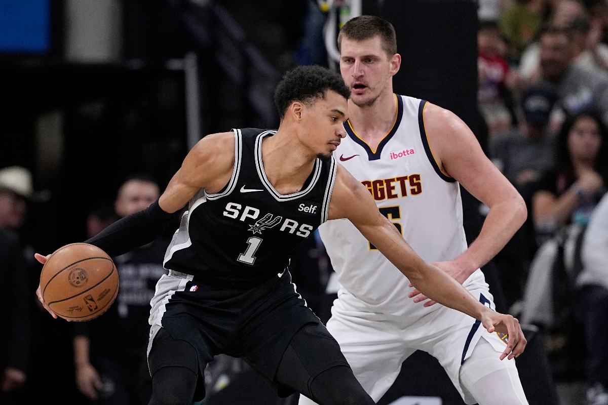 San Antonio Spurs center Victor Wembanyama drives against Denver Nuggets center Nikola Jokic during the first half of an NBA basketball game in San Antonio Friday. (AP)