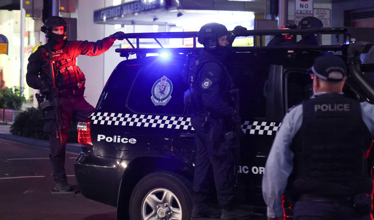 Police patrol in front of the Westfield Bondi Junction shopping mall after a stabbing incident in Sydney on April 13, 2024. The number of people killed by a knife-wielding assailant in a Sydney shopping center on April 13 has climbed to six, police said. (AFP)