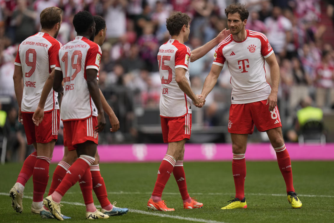 Bayern’s Thomas Mueller is congratulated by Leon Goretzka after scoring his side’s second goal during their Bundesliga match against Cologne at the Allianz Arena in Munich on Apr. 13, 2024. (AP)
