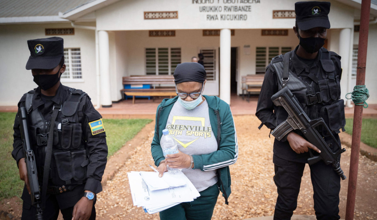 Beatrice Munyenyezi is escorted by police officers at a court in Kigali, Rwanda. (AFP file photo)