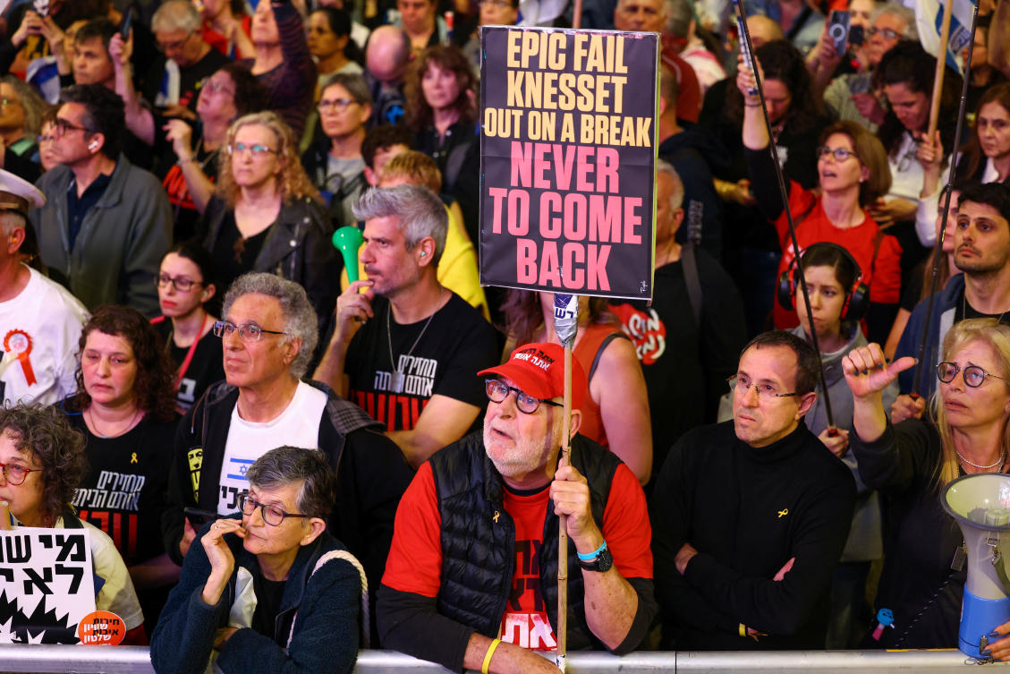 A man holds a sign as people attend a protest against Israeli Prime Minister Benjamin Netanyahu’s government and to call for the release of hostages kidnapped in the deadly October 7 attack, in Tel Aviv on Apr. 13, 2024. (Reuters)