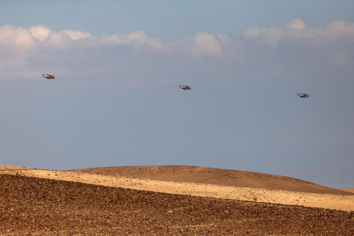 Israeli Air Force heavy lift military transport helicopters fly over in the southern Negev desert on April 14, 2024. (AFP)