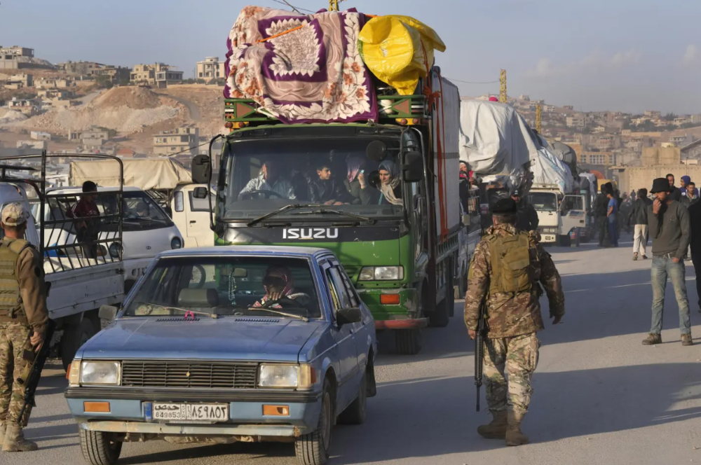 Syrian refugees return to their home country from the Lebanese border town of Arsal, Oct. 26, 2022. (AP Photo)