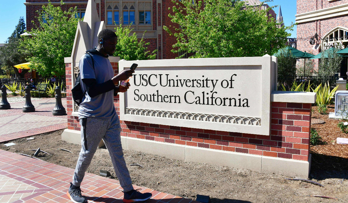 A man looks at his cellphone while walking at the University of Southern California (USC) in Los Angeles, California. (AFP file photo)