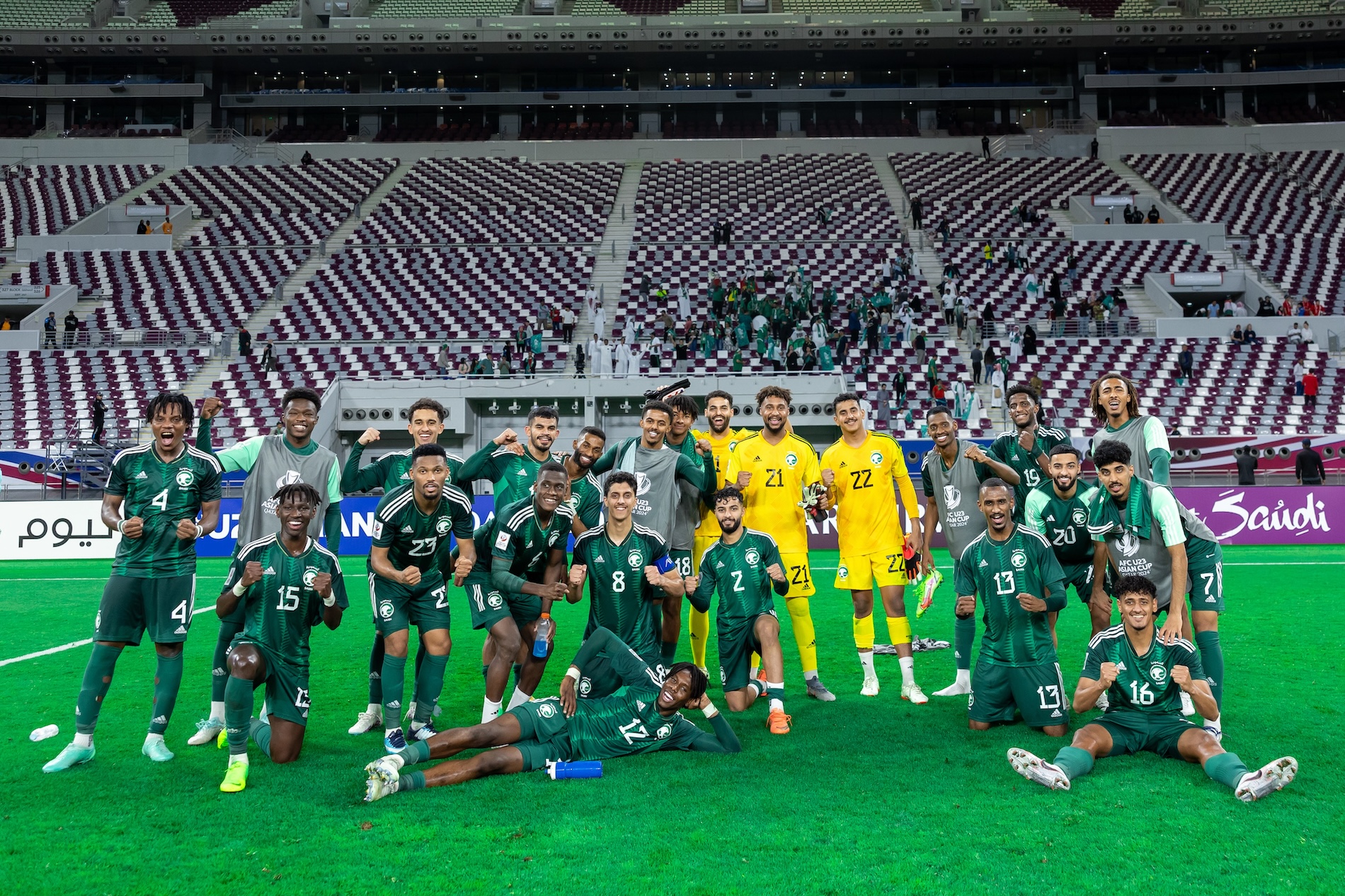 Saudi players ecelbarte beating Tajikistan at the 2024 AFC U-23 Asian Cup in Qatar (X/@SaudiNT)
