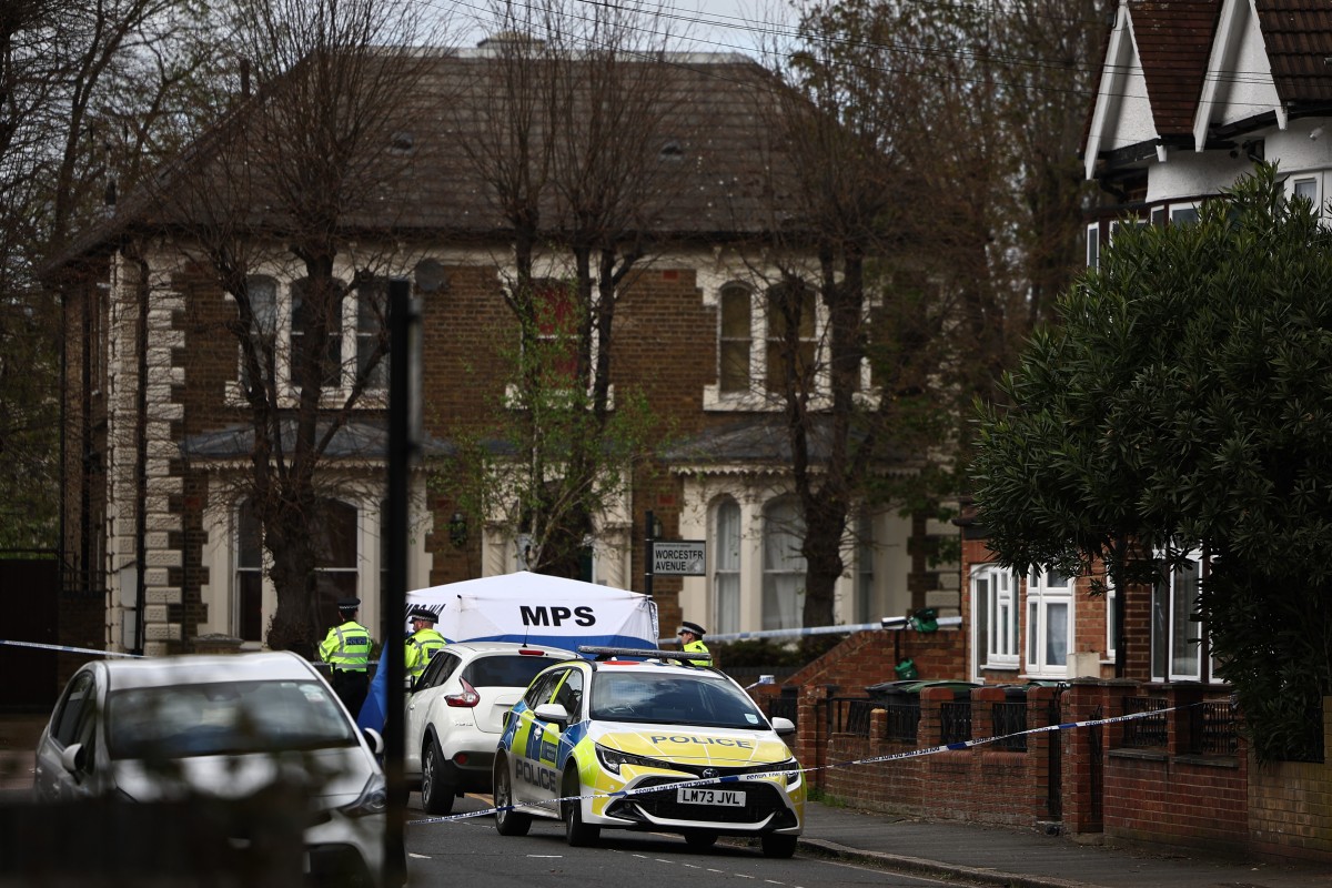 Police officers work behind a cordon set up in a street in London, on April 7, 2024. (AFP)