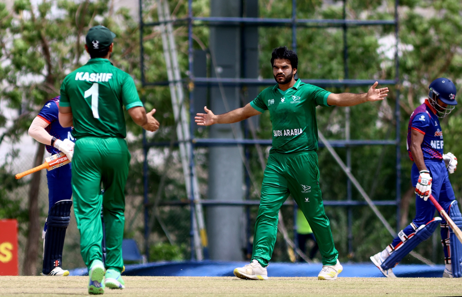 Ishtiaq Ahmad of Saudi Arabia celebrates a wicket in the ACC Men's Premier Cup 2024 Group A match between Nepal and Saudi Arabia at Oman Cricket Stadium Muscat (AN/Subas Humagain)
