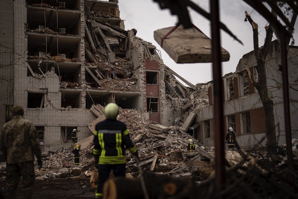 Firefighters work on a building that was partially destroyed after a Russian bombardment in Chernihiv, Ukraine, Wednesday, April 17, 2024. (AP)