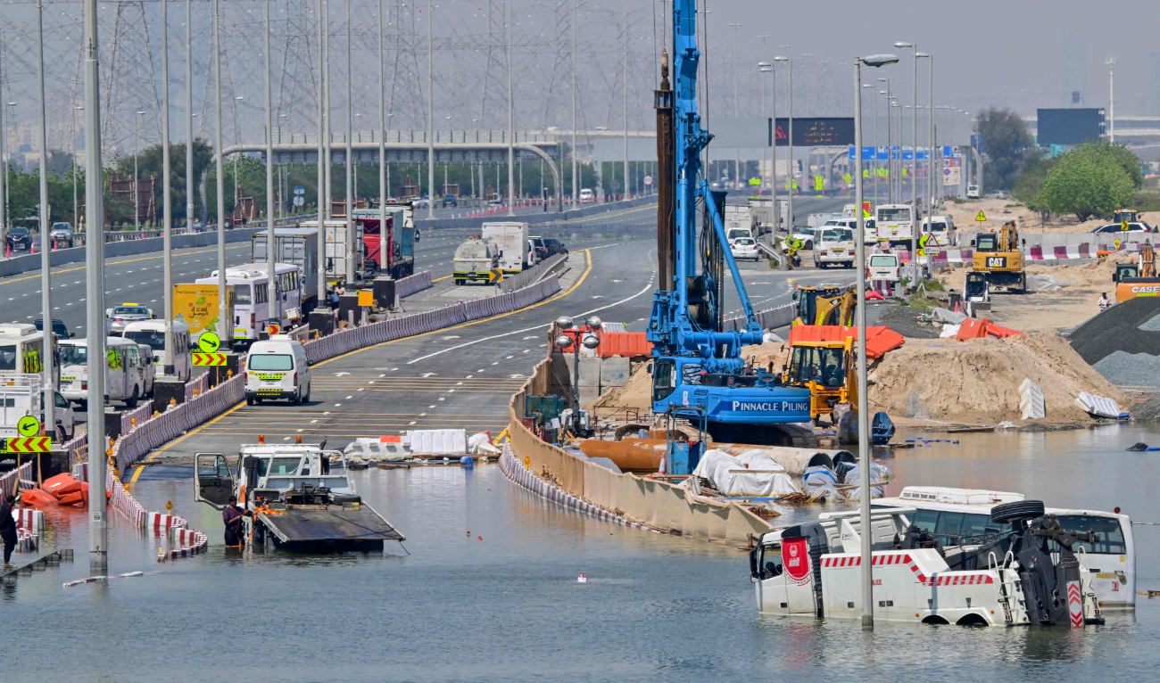 Cars are stranded on a flooded Al-Khalil road in the Al-Barsha area in Dubai following heavy rains. Dubai’s giant highways were clogged by flooding and its major airport was in chaos as the Middle East financial center remained gridlocked on Thursday, two days after the heaviest rains on record. (AFP)