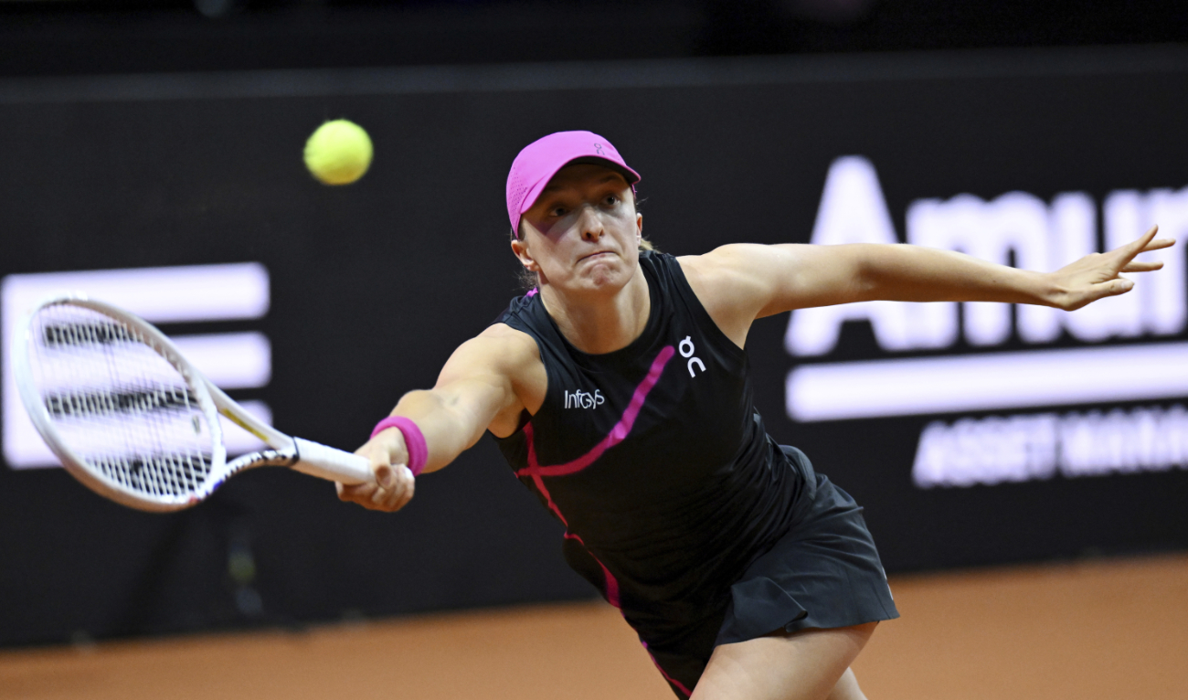 Poland's Iga Swiatek plays Belgium's Elise Mertens during their WTA tennis tournament match in Stuttgart Thursday. (AP)
