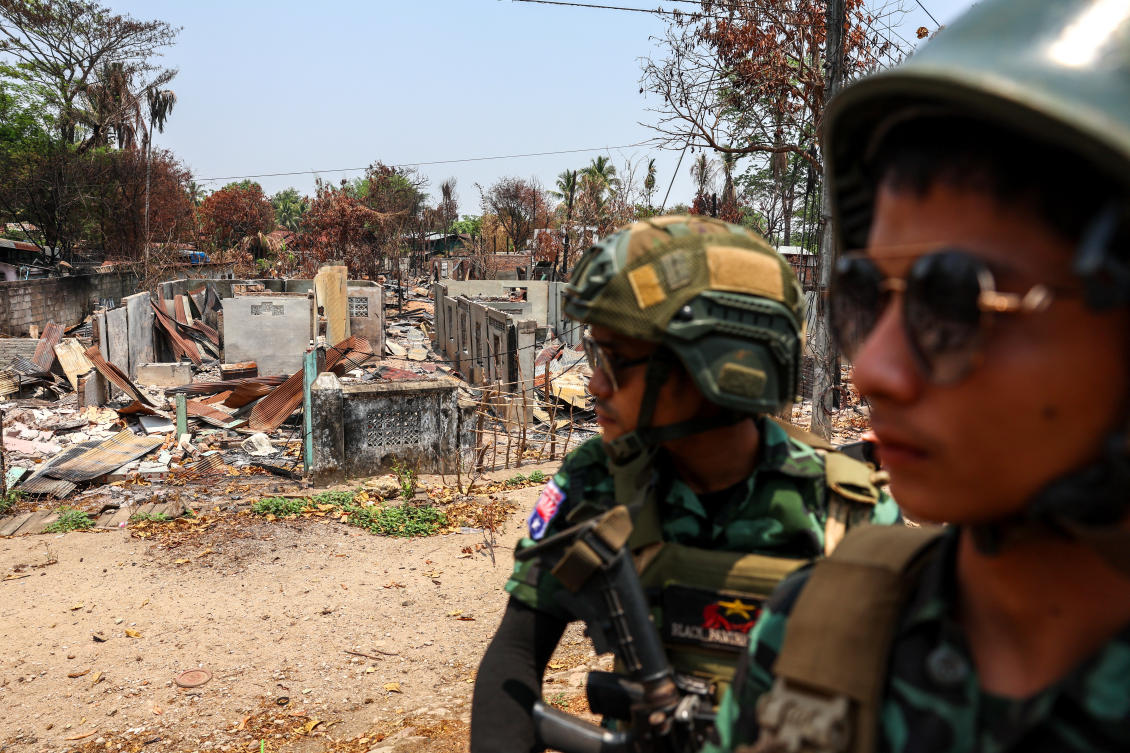 Soldiers from the Karen National Liberation Army patrol next to an area destroyed by Myanmar’s airstrike in Myawaddy near the Thailand-Myanmar border. (Reuters)