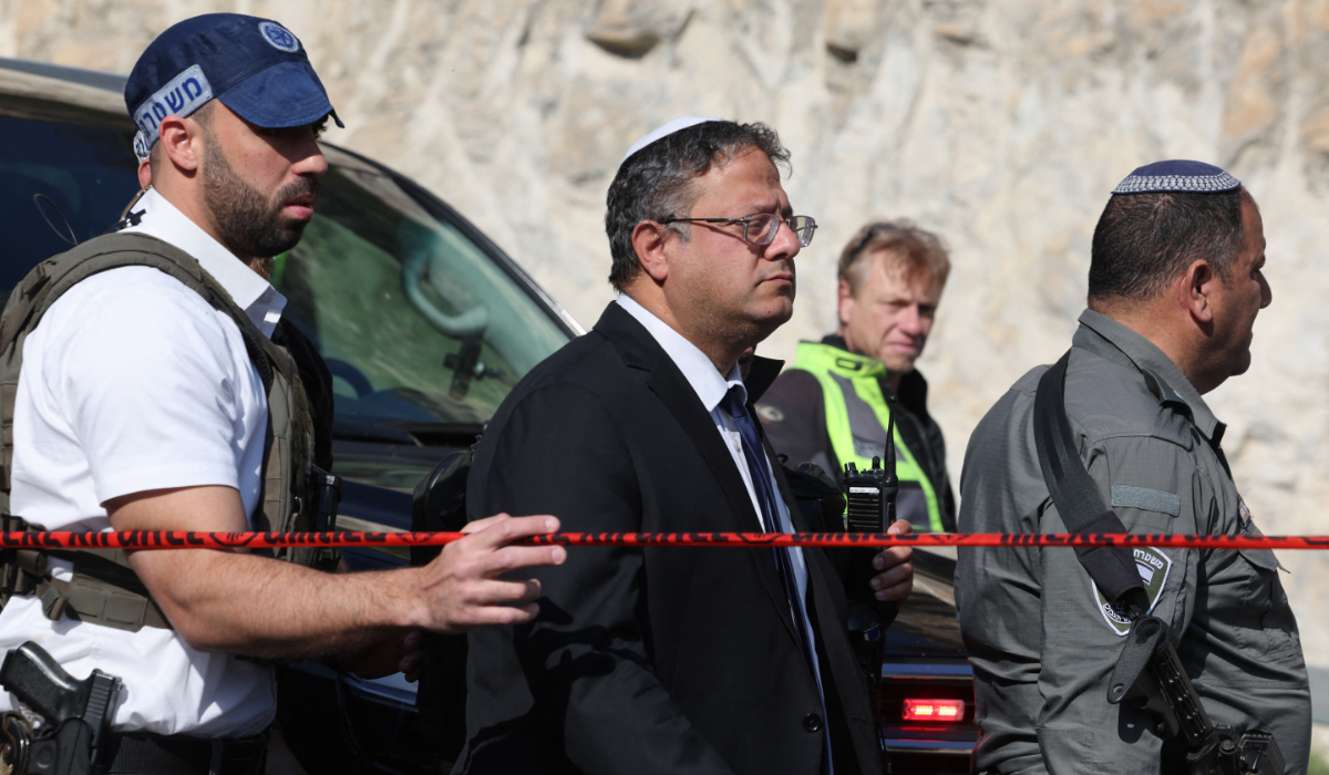 Israel's far-right National Security Minister Itamar Ben Gvir (C) arrives at the scene of a shooting attack near Maale Adumim settlement, east of Jerusalem, on February 22, 2024. (AFP)