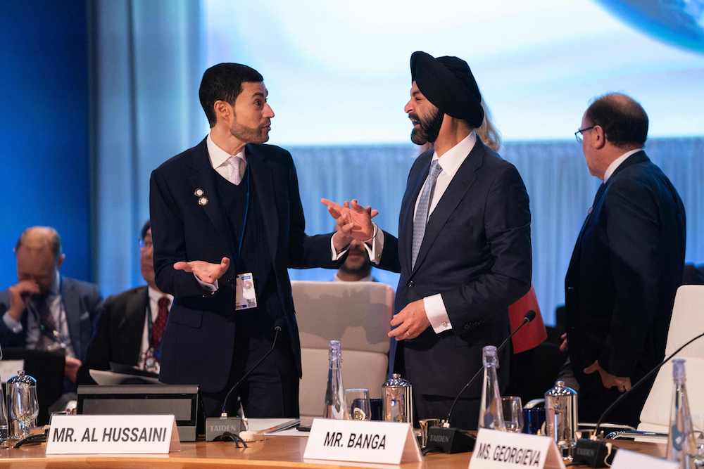 United Arab Emirates Finance Minister and chairman of the World Bank Development Committee Mohamed bin Hadi Al Hussaini speaks with World Bank Group President Ajay Banga during a meeting of the World Bank Development Committee during the IMF-World Bank Group spring meetings at World Bank headquarters in Washington DC. (AFP)