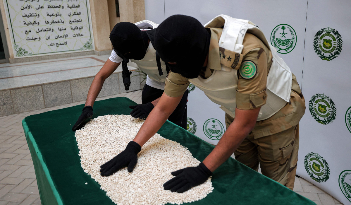 Officers of the Directorate of Narcotics Control of Saudi Arabia's Interior Ministry sort through tablets of captagon (Fenethylline) seized during a special operation in the Red Sea coastal city of Jeddah. (AFP file photo)