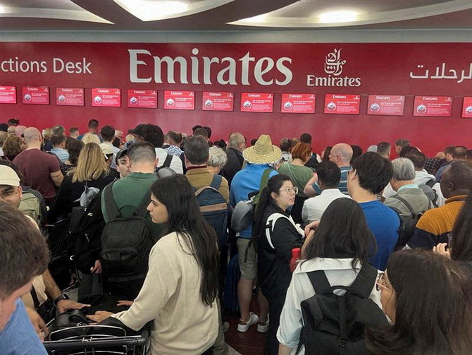 Emirates canceled nearly 400 flights and delayed many more as a result of a record storm that hit the desert city of Dubai on Tuesday. (Reuters)