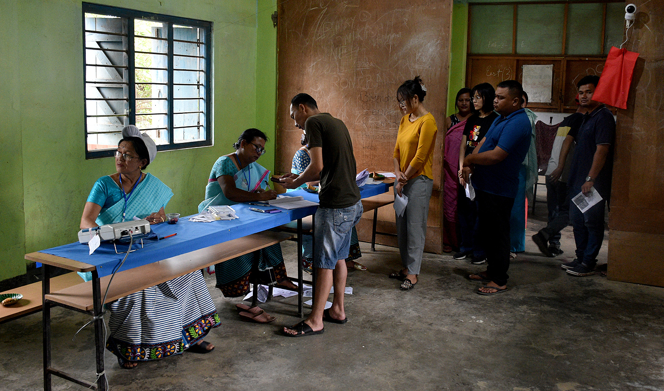 People wait to cast their votes at a polling station during the first phase of the general election, in Imphal, Manipur, India, April 19, 2024. (REUTERS)
