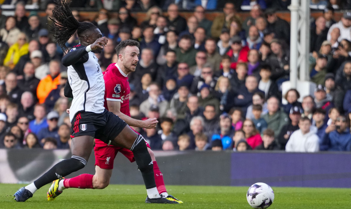 Liverpool's Diogo Jota scores his side's third goal during the English Premier League soccer match between Fulham and Liverpool at Craven Cottage stadium in London, Sunday. (AP)