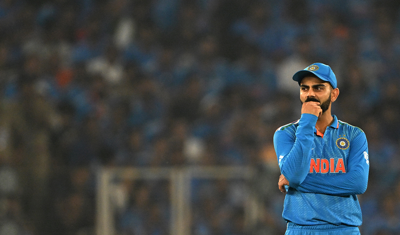 India's Virat Kohli watches while fielding during the 2023 ICC Men's Cricket World Cup one-day international (ODI) final match between India and Australia at the Narendra Modi Stadium in Ahmedabad on November 19, 2023. (AFP/File)
