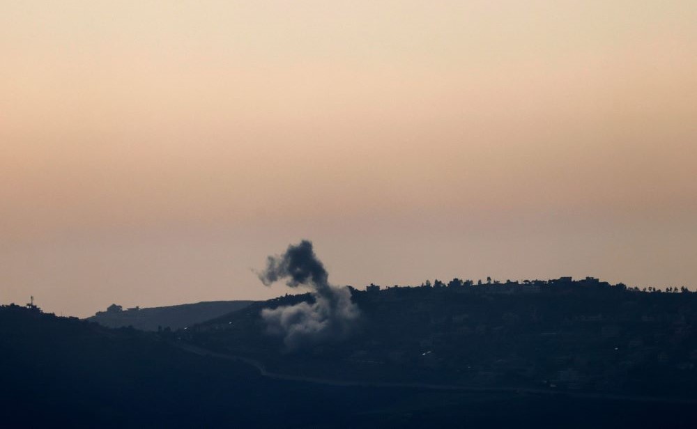 This picture taken from an Israeli position along the border with southern Lebanon shows smoke billowing above the Lebanese village of Odaisseh during Israeli bombardment, Apr. 22, 2024. (AFP)