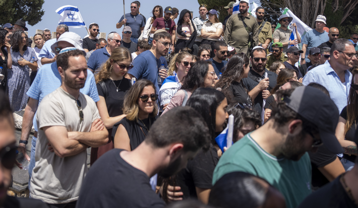 People mourn in grief during the funeral for Israeli reserve Major Dor Zimel in Even Yehuda, Israel, on Monday, April 22, 2024. Zimel, 27, died of his wounds after Hezbollah group fired a volley of rockets and drones on northern Israel on April 17. (AP)