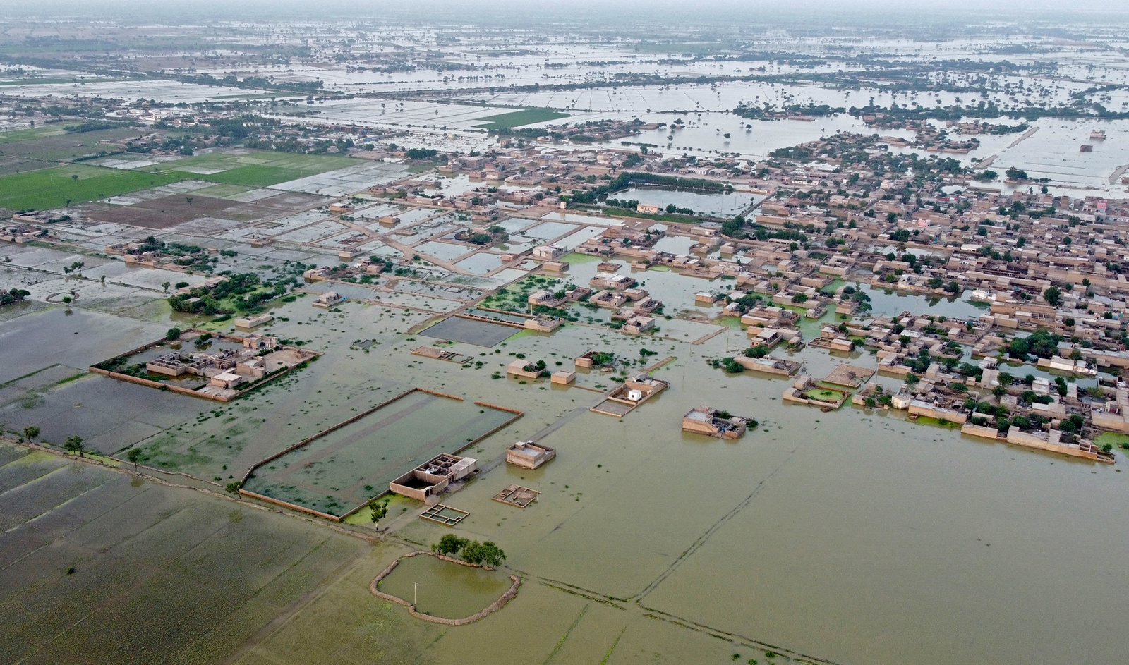 This aerial photograph taken on September 5, 2022 shows flooded residential areas after heavy monsoon rains in Dera Allah Yar, Balochistan province. (AFP)