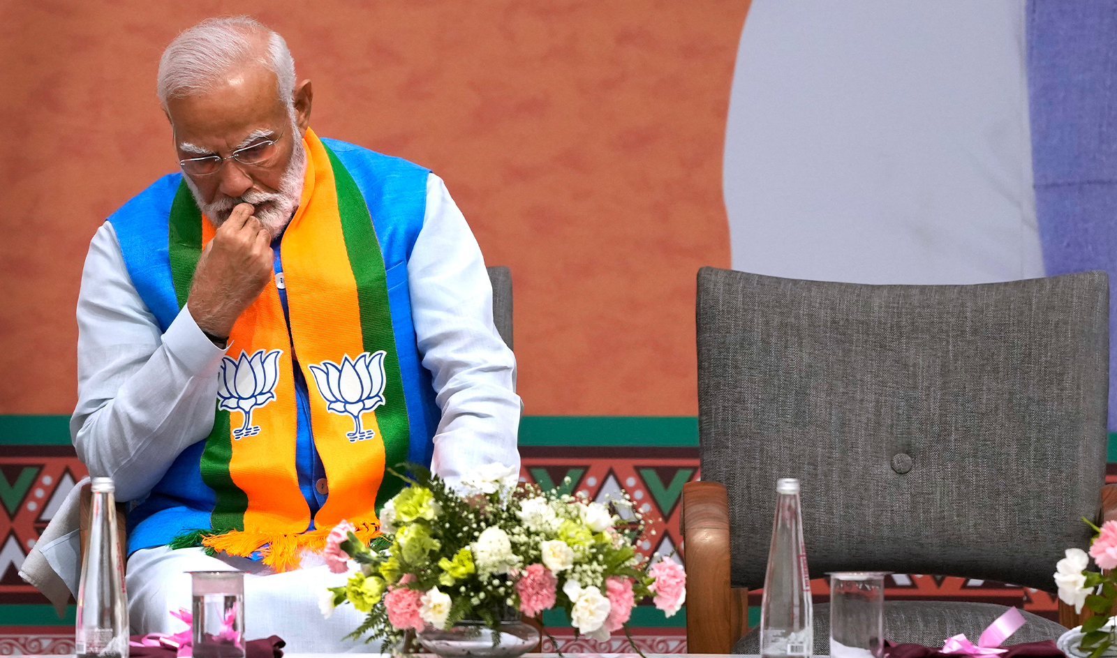 Indian Prime Minister Narendra Modi listens to Bharatiya Janata Party (BJP) President JP Nadda speak during an event organized to release their party's manifesto for the upcoming national parliamentary elections in New Delhi, India, on April 14, 2024. (REUTERS)