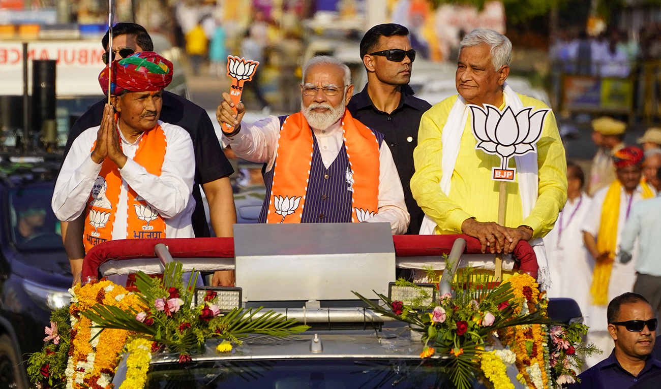 India's Prime Minister Narendra Modi (C) gestures at a roadshow in Dausa on April 12, 2024, ahead of the country's general elections. (AFP/File)