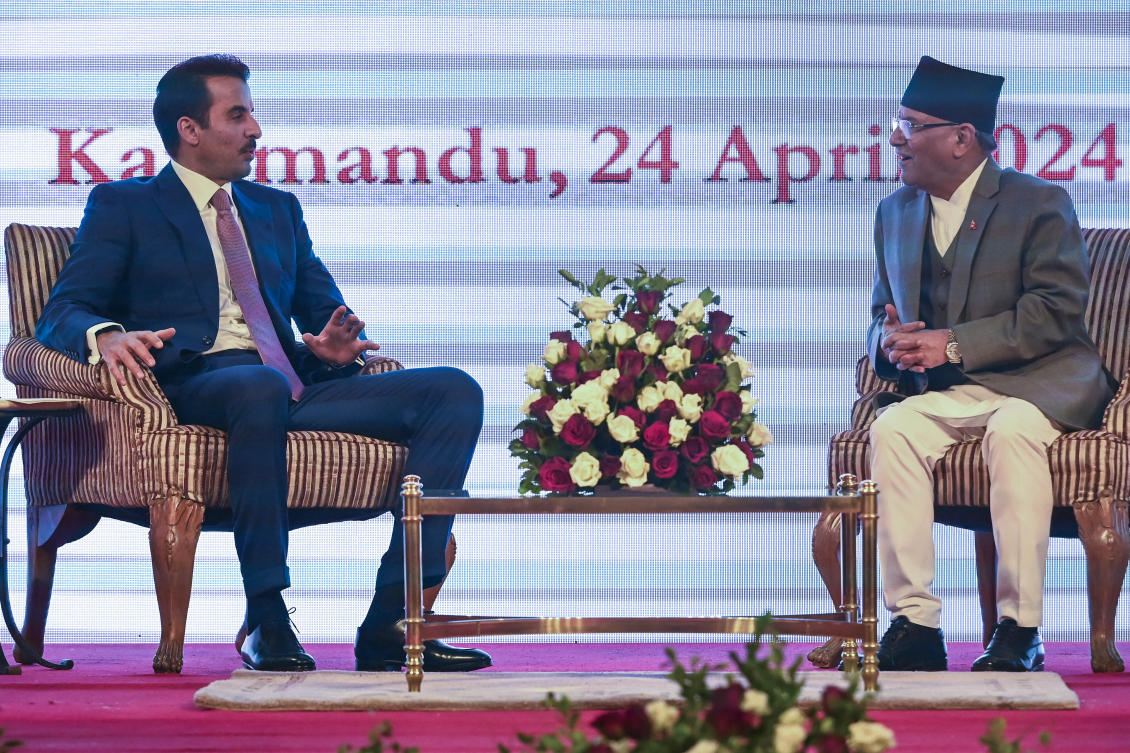 Qatar's Emir Sheikh Tamim bin Hamad al-Thani, left and Nepal's Prime Minister Pushpa Kamal Dahal attend the signing of agreements ceremony in Kathmandu, Nepal. (File/AP)