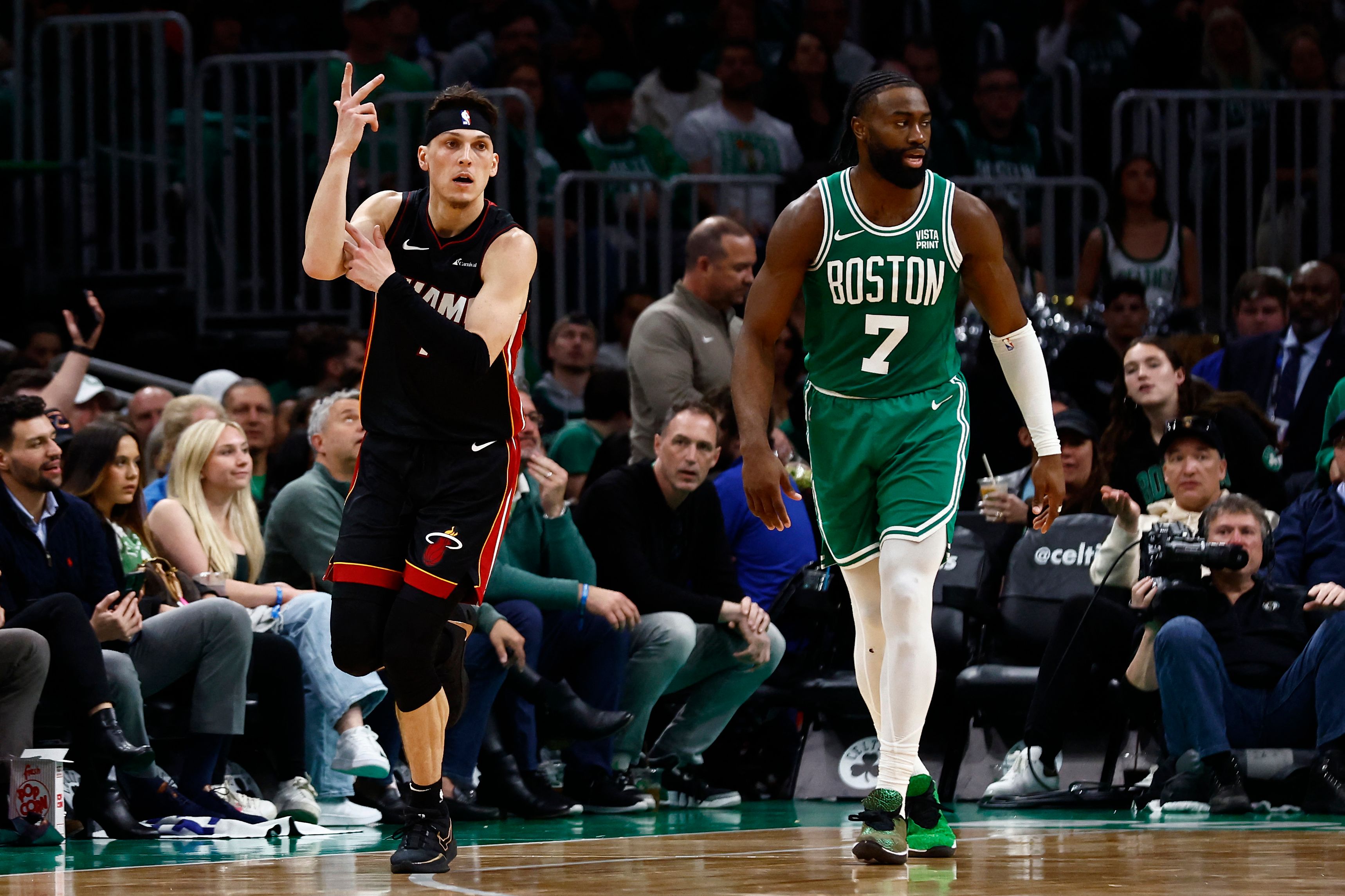 Tyler Herro of the Miami Heat celebrates a three-point basket as he runs past Jaylen Brown of the Boston Celtics during the third quarter of Game 2 of the Eastern Conference First Round Playoffs at TD Garden. (AFP)