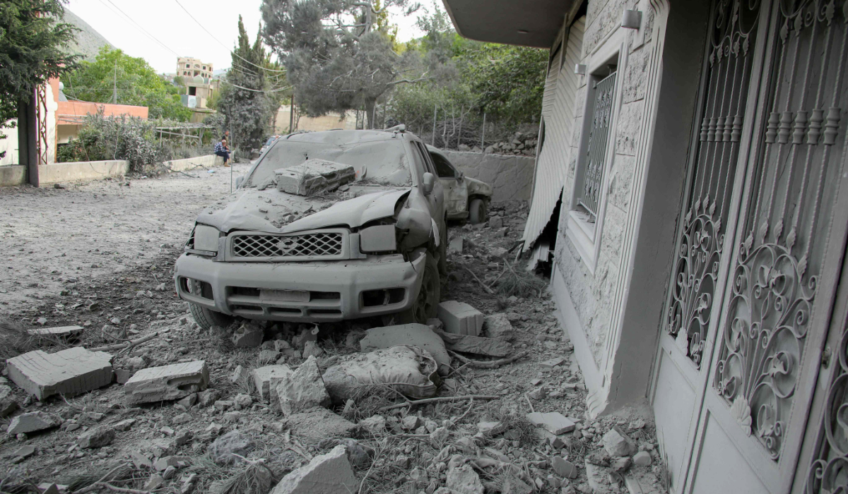 Rubble litters the area around a house which was hit overnight by an Israeli airstrike in the southern Lebanese village of Shebaa near the border on April 26, 2024, amid ongoing cross-border tensions as fighting continues between Israel and Palestinian Hamas militants in Gaza. (AFP)