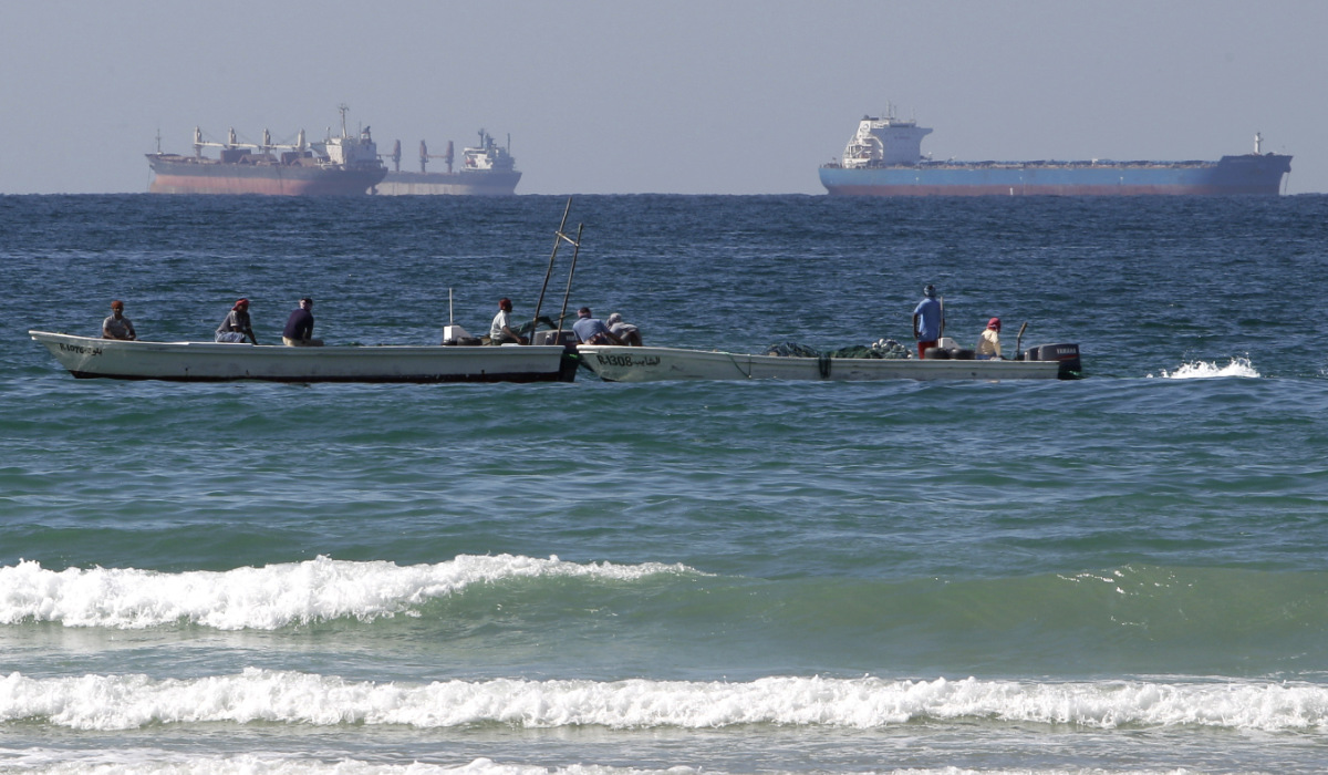 In this Jan. 19, 2012 file photo, fishing boats are seen in front of oil tankers on the Persian Gulf waters, south of the Strait of Hormuz. (AP)