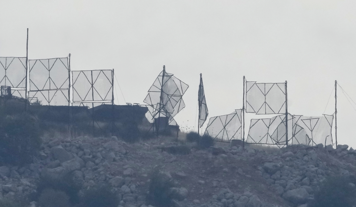 The fence of an Israeli military position is seen damaged after Hezbollah's rocket attacks, on an occupied hill of Kfar Chouba village, southeast Lebanon, Sunday, Oct. 8, 2023. (AP)