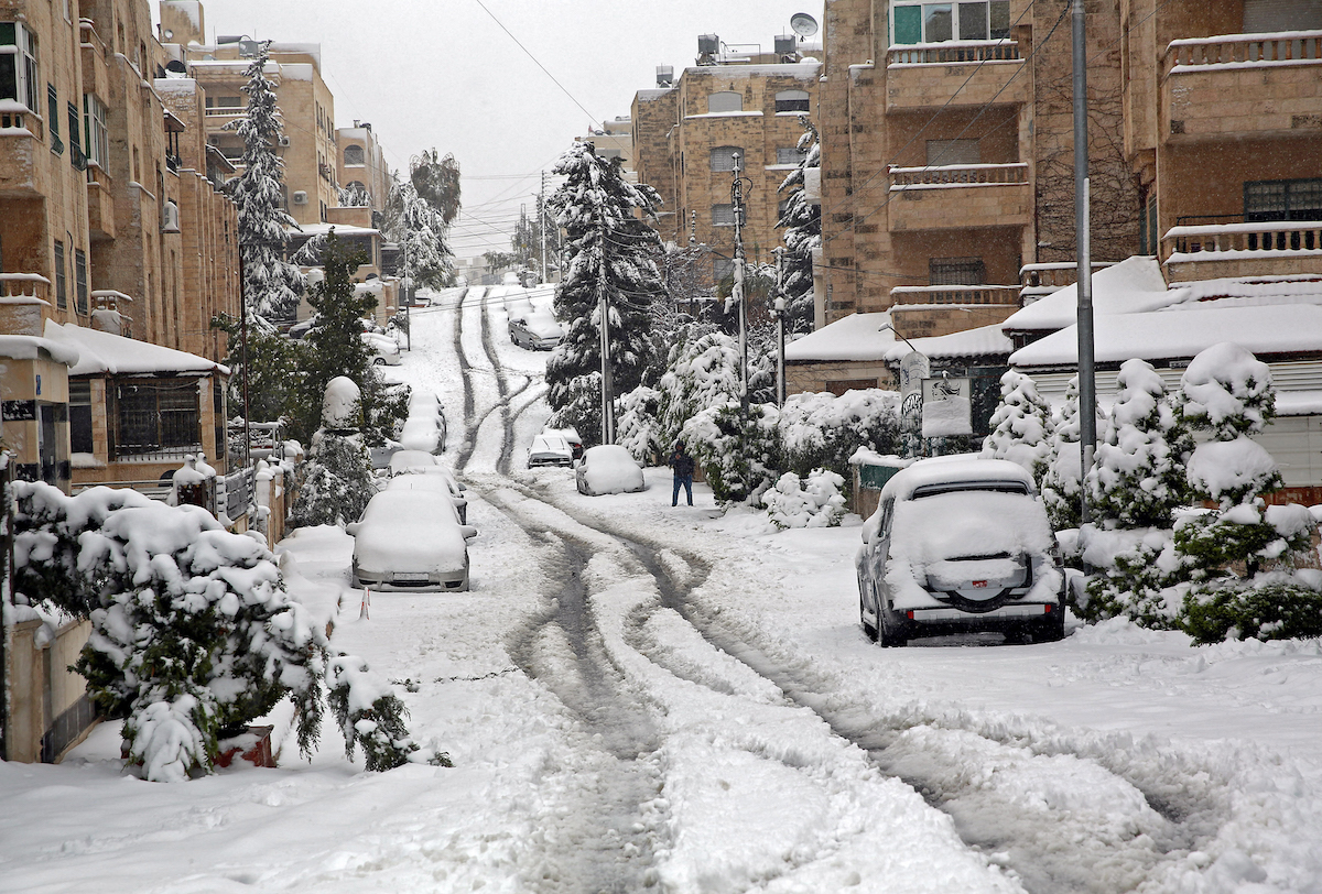 A street is covered in snow following a snowstorm in the Jordanian capital Amman, on February 18, 2021. (File/AFP)