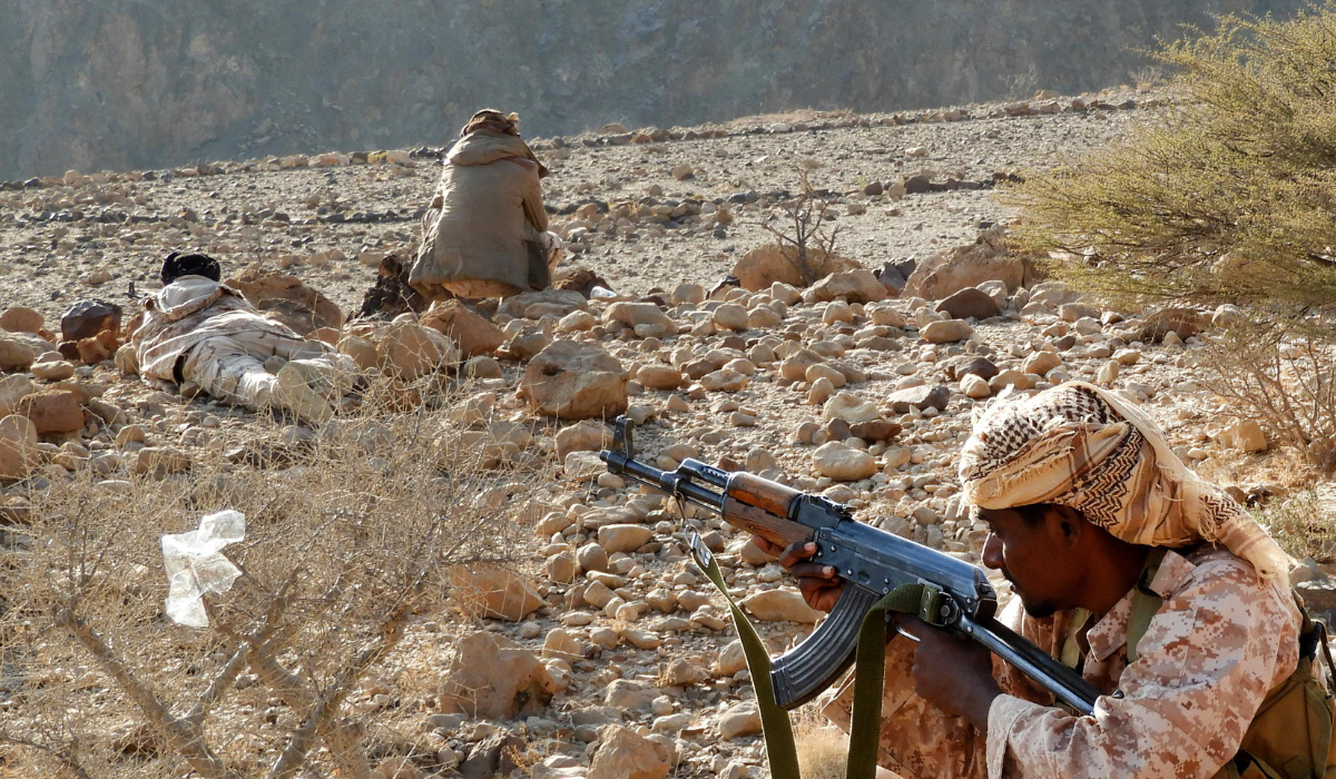 Yemeni fighters loyal to the government take position as they close in on a suspected location of an Al-Qaeda in the Arabian Peninsula (AQAP) leader during their the offensive in the Mesini Valley in the vast province of Hadramawt on February 21, 2018. (AFP)