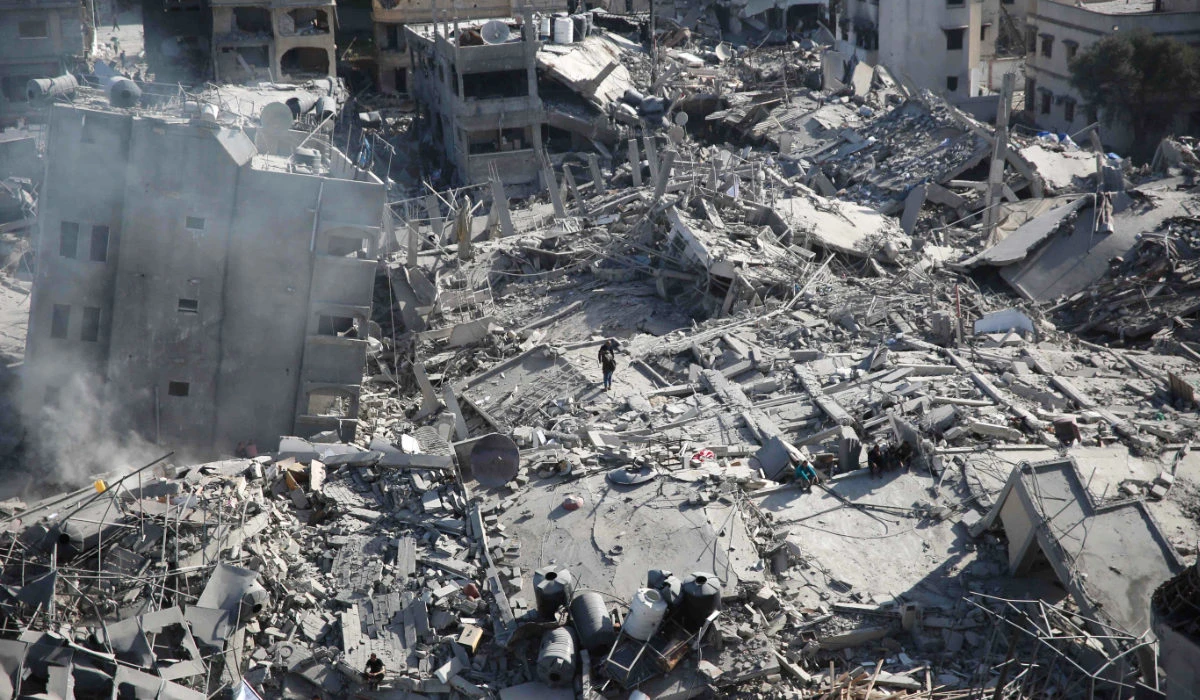 Palestinians inspect the damage in the area around Gaza's Al-Shifa hospital after the Israeli military withdrew on April 1, 2024, amid the ongoing battles Israel and the Hamas militant group. (AFP)