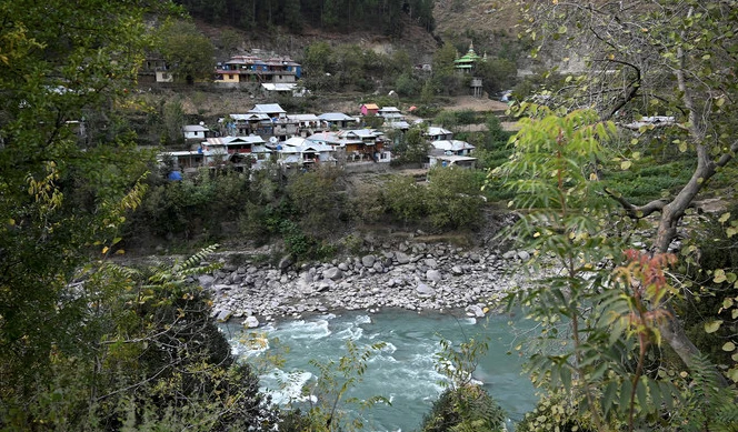 This general view taken on October 14, 2020 shows houses built on the Pakistani side of Kashmir, seen from Tithwal village at the Line of Control (LOC). (AFP/File)