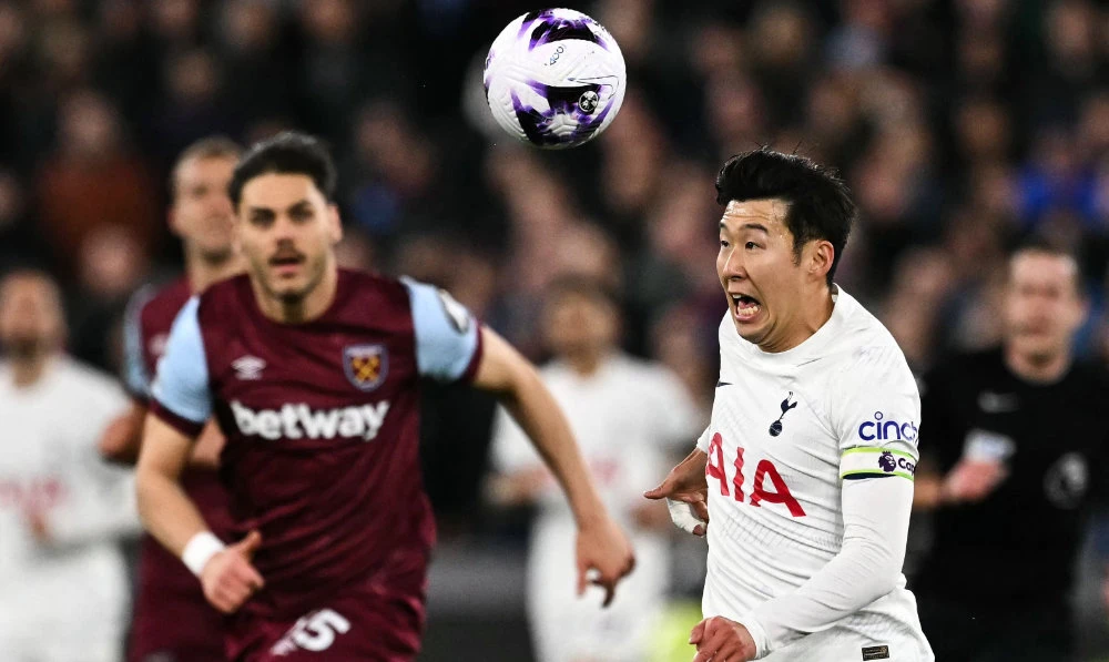 Tottenham Hotspur's South Korean striker Son Heung-Min (R) during the English Premier League football match between West Ham United and Tottenham Hotspur at the London Stadium, in London on April 2, 2024. (AFP)
