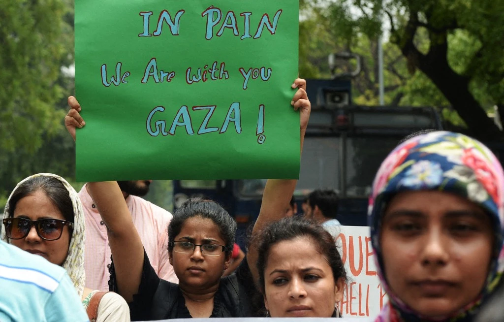 Indian protesters hold placards as they take part in a rally against Israeli attacks on Gaza in New Delhi on July 13, 2014. (AFP/File)