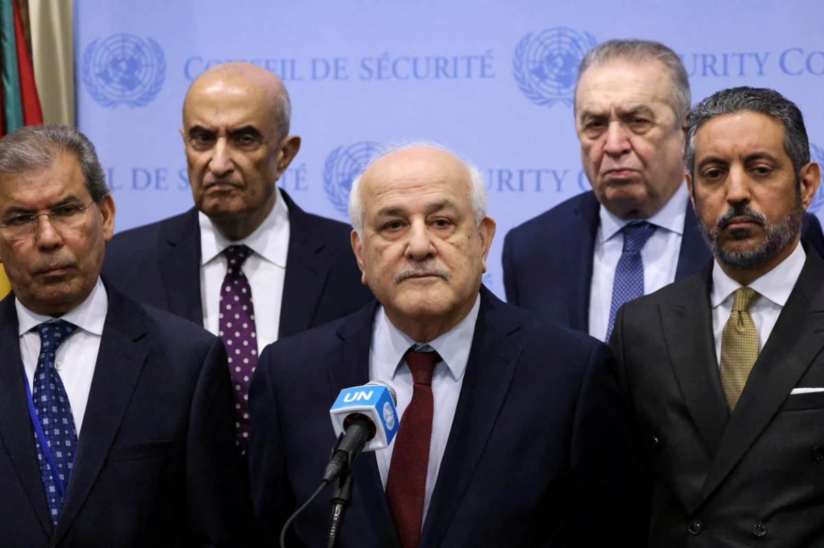 Palestinian Ambassador to the UN Riyad Mansour (center), shown here with Yemen's Ambassador Abdullah Ali Fadhel Al-Saadi and Algeria's UN Representative Amar Bendjama, is pushing for a vote in the UN Security Council on April 5, 2024 to recognize his nation as a full member state next month. (Reuters)