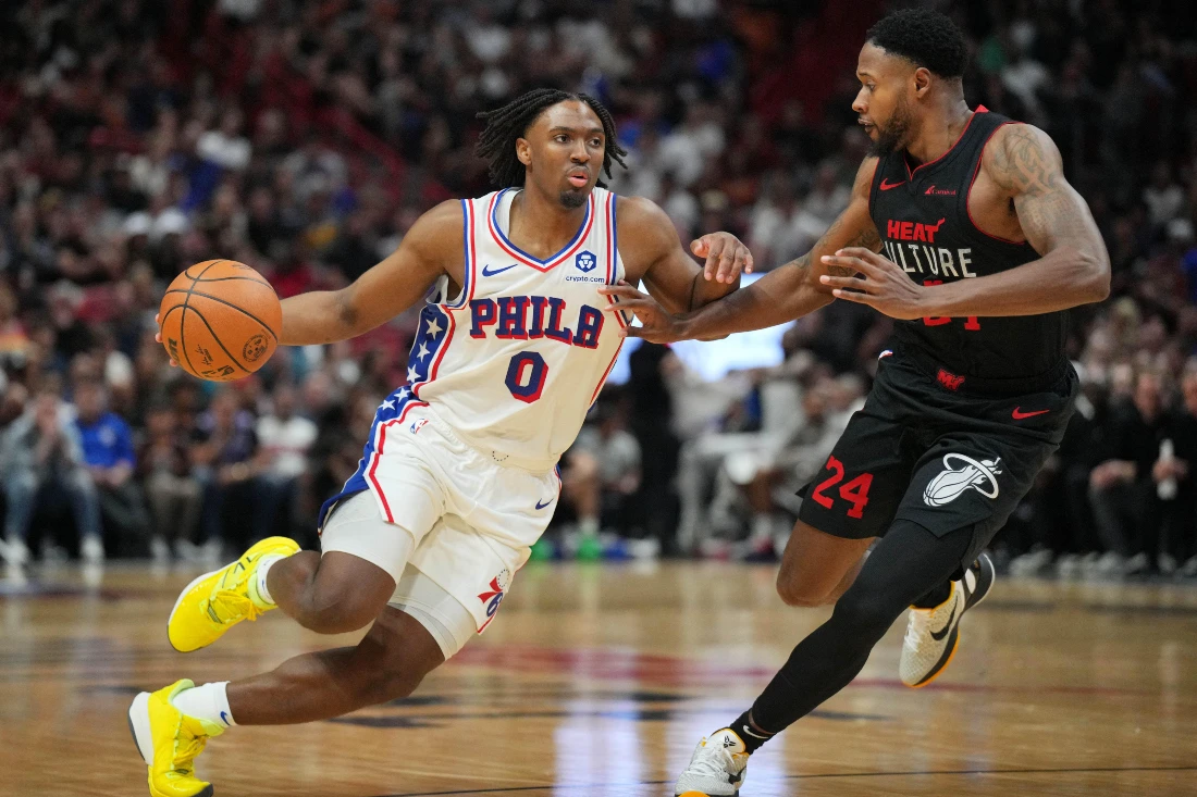Philadelphia 76ers guard Tyrese Maxey (0) drives past Miami Heat forward Haywood Highsmith (24) during the second half of an NBA game at Kaseya Center. (USA TODAY Sports)