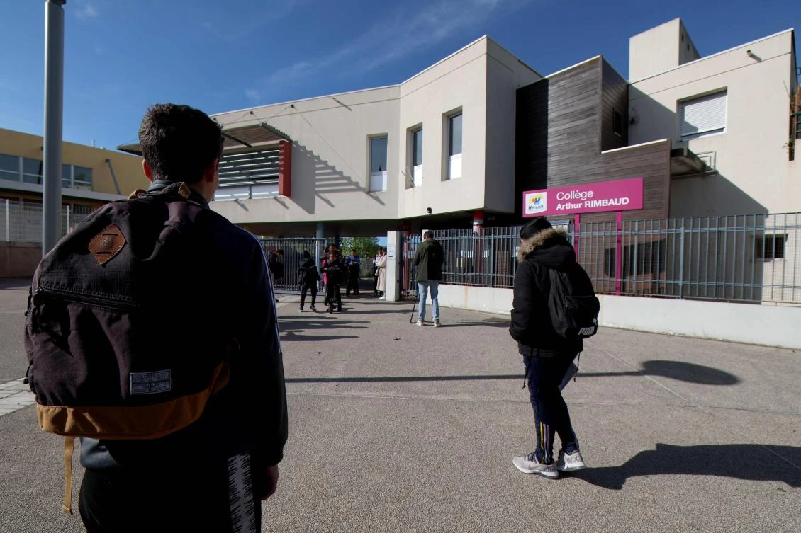 Students arrive on Apr. 4, 2024 in Montpellier at the College Arthur-Rimbaud secondary school a day after a 14-year-old girl was assaulted outside the school. (AFP)