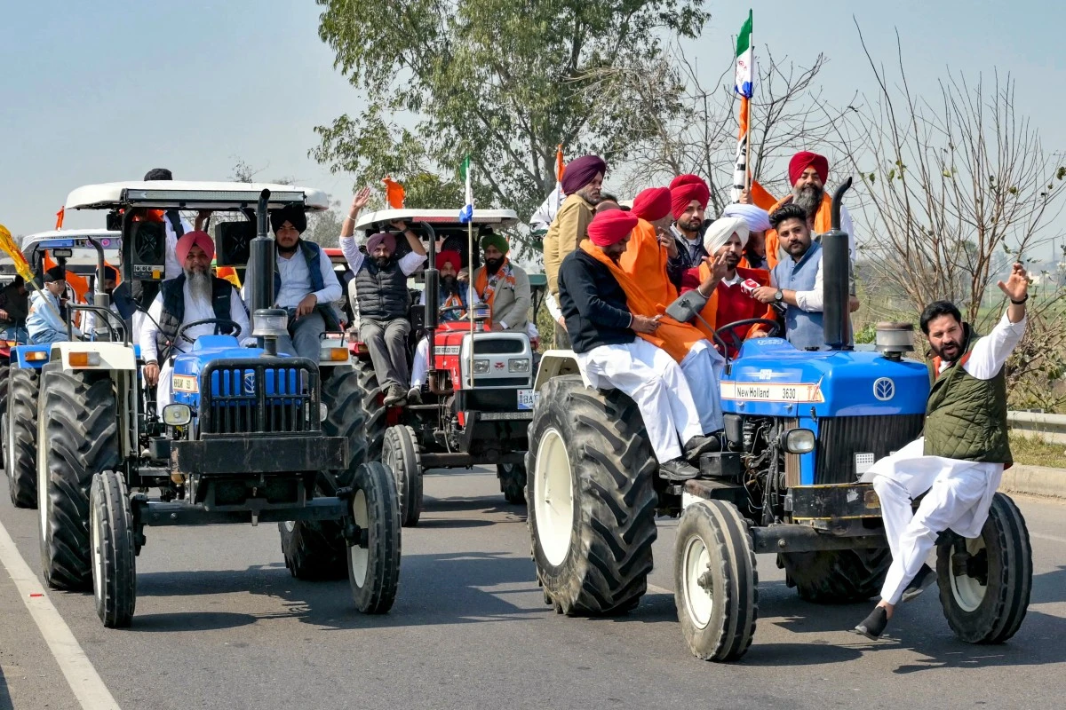 Protesting farmers ride tractors during a rally against central government to demand minimum crop prices on the outskirts of Amritsar on Feb. 28, 2024. (AFP/File)