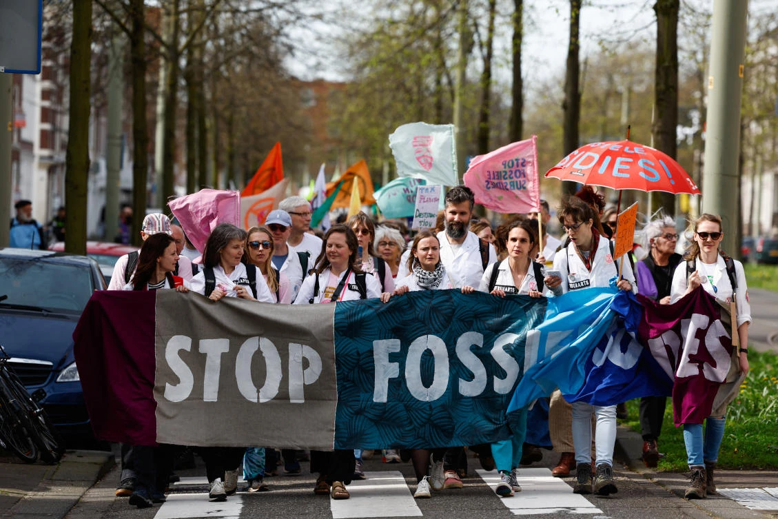 Climate activists march to block the A12 highway to ensure that the Dutch government stops subsidies for fossil fuels, in The Hague on Apr. 6, 2024. (Reuters)