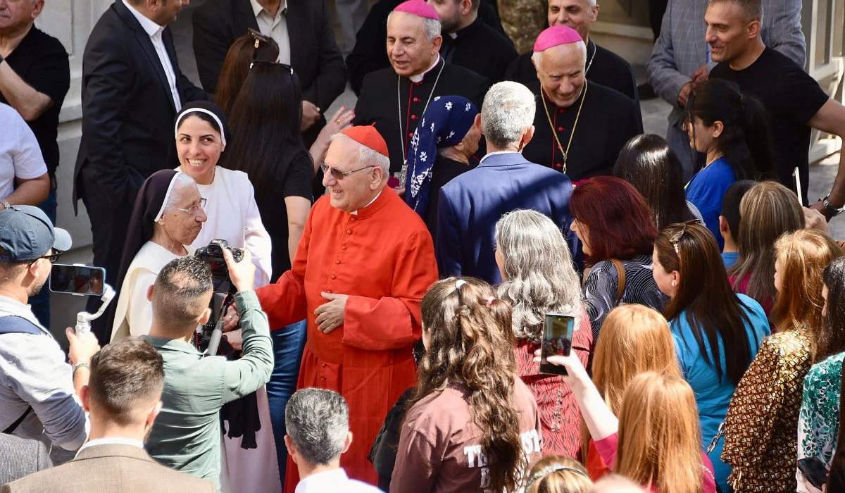 Patriarch Raphael Sako arrives to celebrate mass in the 80-year-old Chaldean Catholic Church of Um Al-Mauna in Mosul in northern Iraq. (AFP)