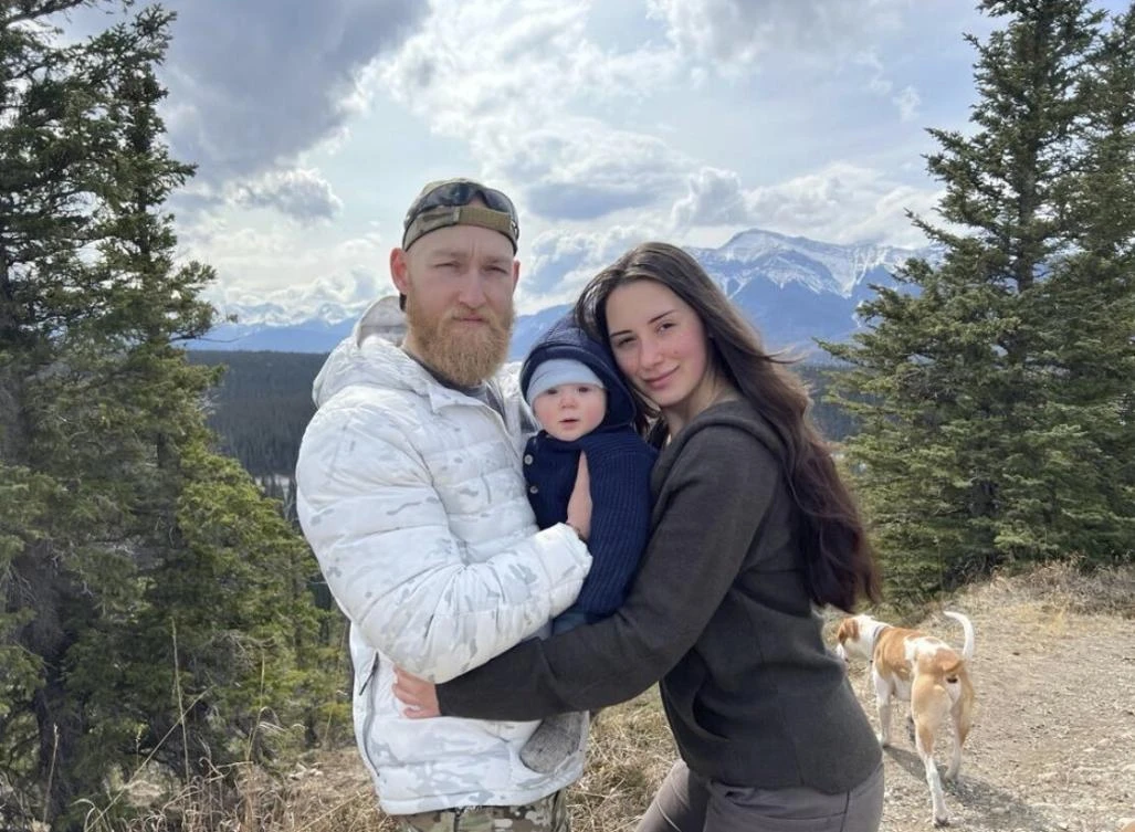 This photo provided by John Flickinger, Friday, April 5, 2024, shows his son Jacob Flickinger, left, and Sandy Leclerc, right, with their son Jasper. (AP)