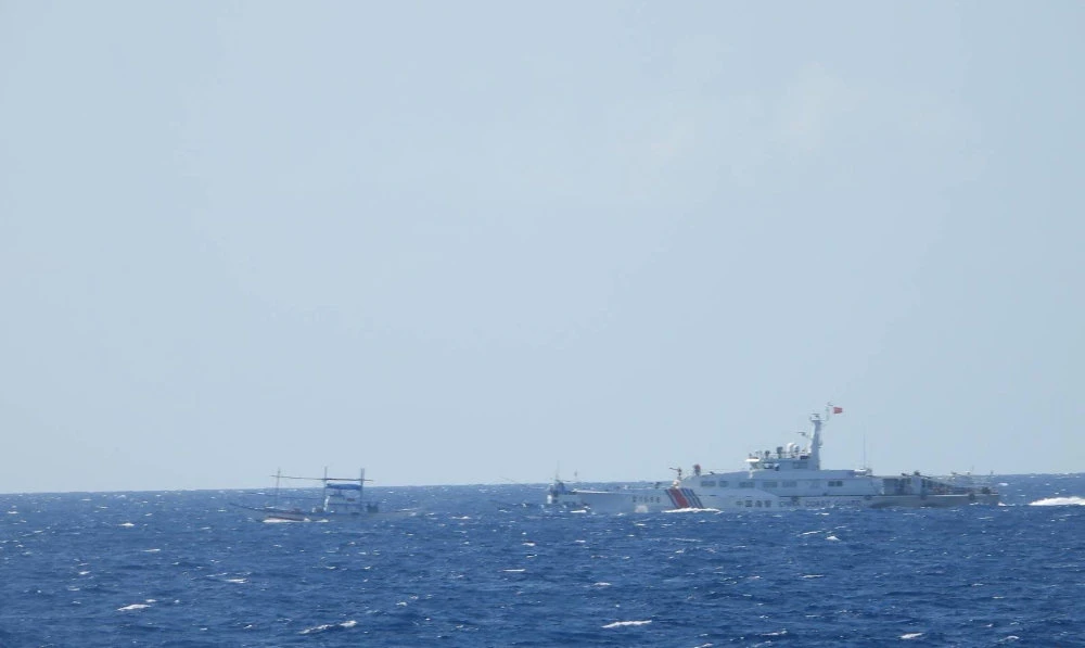 A Chinese coastguard vessel approaches a Filipino fishing vessel in the South China Sea on April 4, 2024, in a handout photo by the Philippine Coast Guard that was released on April 6, 2024. (Reuters)