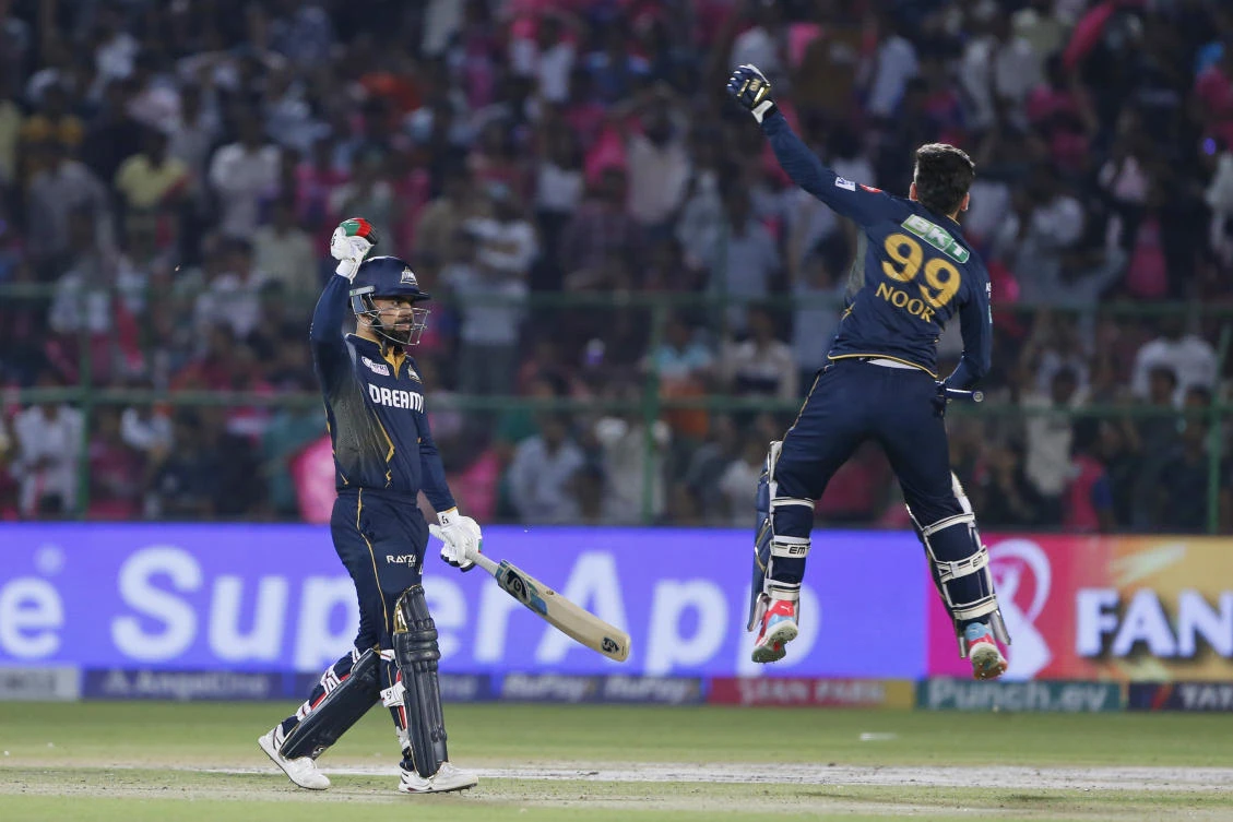 Gujarat Titans’ Rashid Khan, left, and teammate Noor Ahmad celebrate their team’s victory in the IPL cricket match against Rajasthan Royals in Jaipur, India, Wednesday, Apr. 10, 2024. (AP Photo)