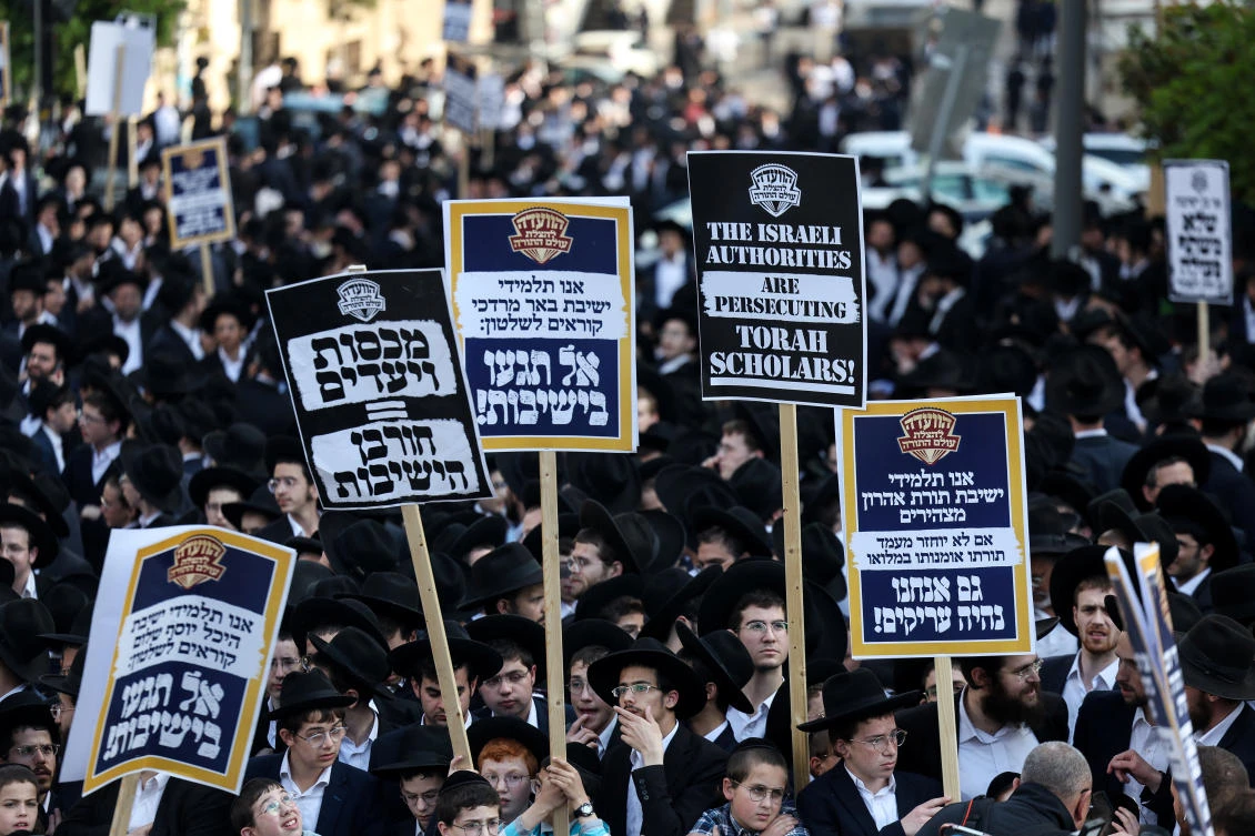 Ultra-Orthodox Jewish men protest against attempts to change government policy that grants ultra-Orthodox Jews exemptions from military conscription, in Jerusalem Apr. 11, 2024. (Reuters)