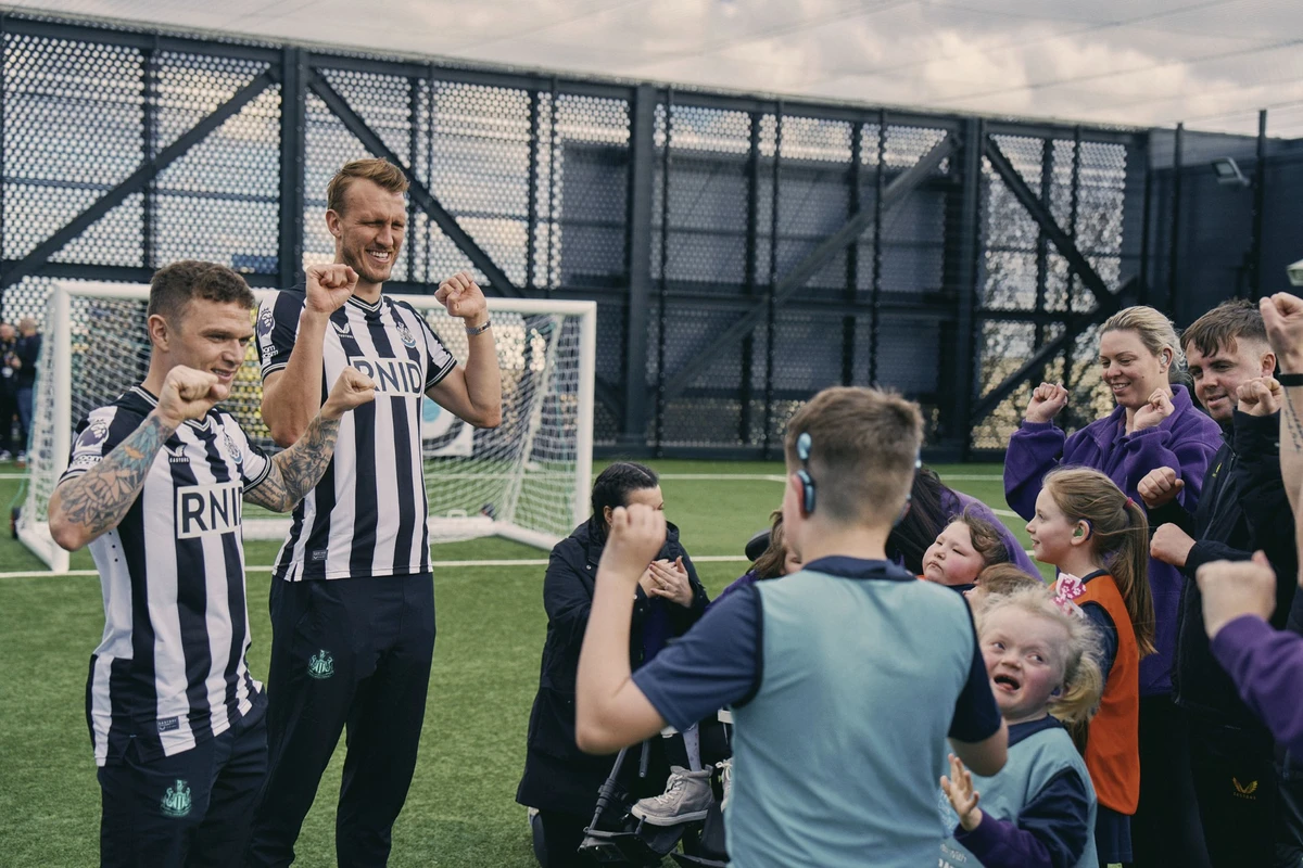 NUFC’s Kieran Trippier and Dan Burn meet with deaf fans at the Newcastle United Foundation to invite them to be mascots for Saturday’s clash against Tottenham Hotspur. (Supplied)