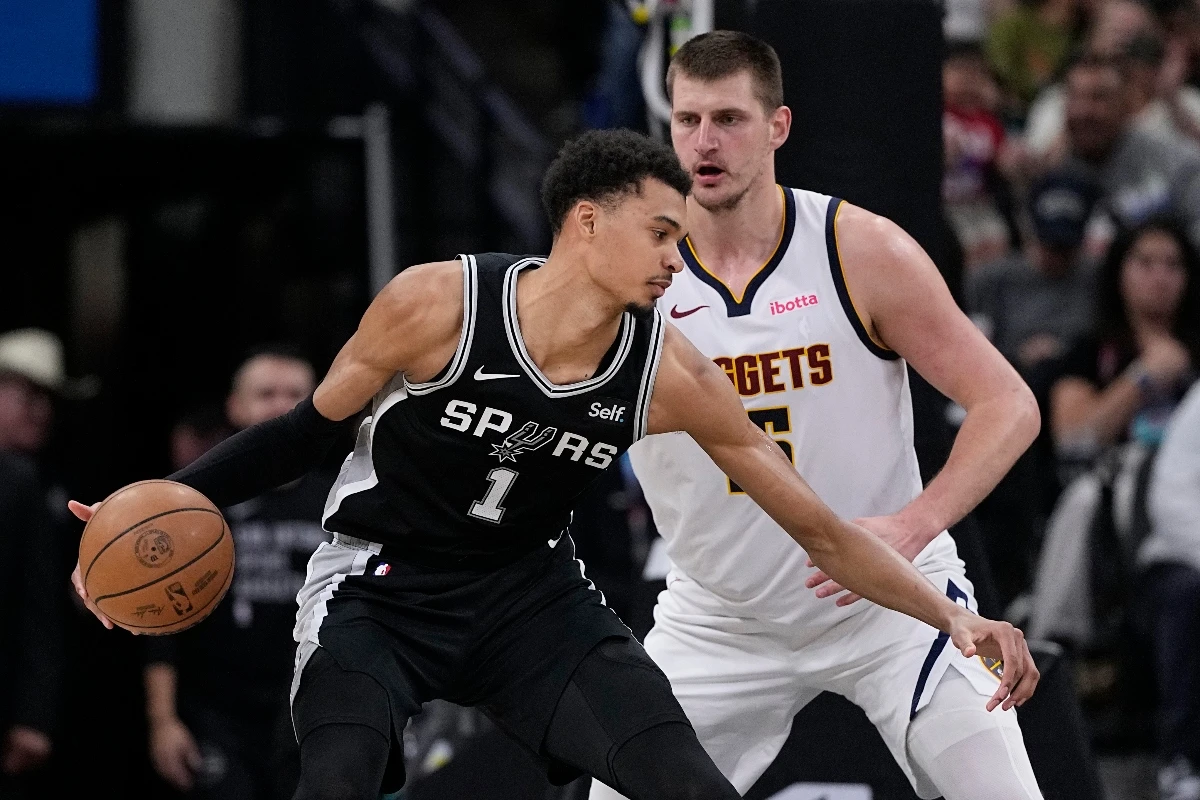 San Antonio Spurs center Victor Wembanyama drives against Denver Nuggets center Nikola Jokic during the first half of an NBA basketball game in San Antonio Friday. (AP)